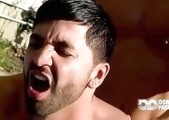 Muscle guys drill in the garden