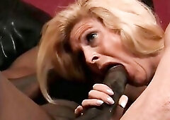Playful golden-haired housewife Sugar Kane has specific hobby to go down and do tricks with giant ebony bone.
