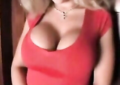 sara jay showcasing her precious boobs in a red shirt and flexing