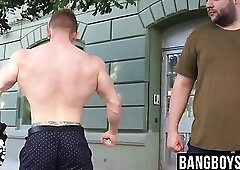 Burly deviant flexing alongside hunk before battle