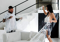 Simon Kitty opens up her legs for a tattooed man on a sofa