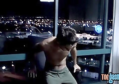 Handsome jock teases with his feet and jerks off solo