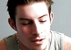 Jock smokes and relaxes while tugging on his big dick