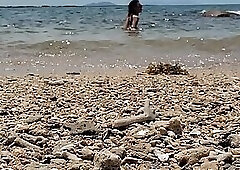 Sexy shemale exhibitionist strokes big cock on beach