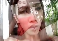 Imposing Asian ladyboy strokes his impotent little cock real slowly