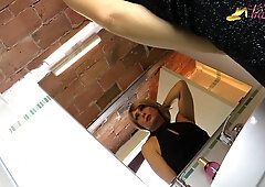 Blonde tgirl in ebony stockings peeing on her own feet