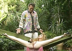 CLASSIC REDHEAD ANNIE BODY MASTURBATES AND GETS SCREWED ON A HAMMOCK.