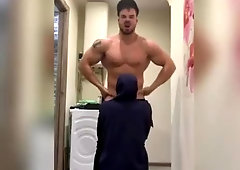 Bodybuilder muscle flexing while getting a blowjob