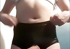 Amateur shemale in tight latex pants plays with her cock