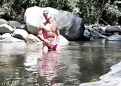 Trans chap ftm jacking off large clitoris with sex toy in the river