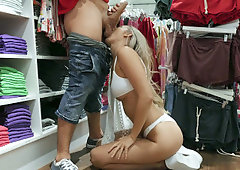 Blonde Addie Andrews on her knees is sucking cock