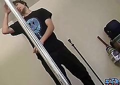 Hung twink performs a striptease before stroking his big cock