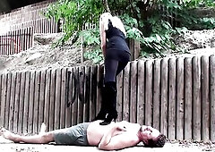 Princess Paris tramples Joschi in front and then in the open with its high boots at the back 1st. The sadistic youthful Mistresse pitilessly drills it