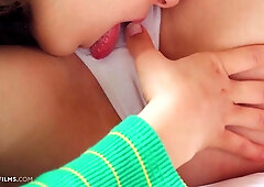 Lesbian girlfriends fucking passionately together on the bed