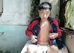 Super Asian boy lies in abandoned factory area, lying in sink, masturbating, ejaculating, moaning,