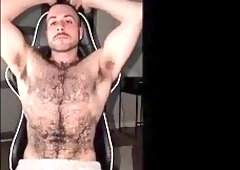 Muscled hairy dude teasing bushy pits