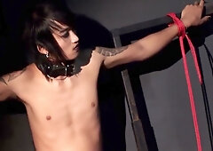 Asian mistress in latex and stilettos commands her dungeon with iron grip