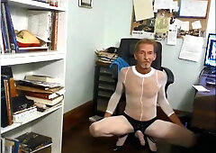 ROBERT RICHARD MILGATE IS A BITCH DRESSED IN A SHEER WHITE BODYSTOCKING AND HIGH STILETTOS