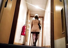 Nick Carter UK transvestite going out for an evening walk from his hotel whilst away on business, clothed as a woman.