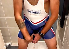 Athletic guy masturbating in his tight wrestling singlet bodysuit