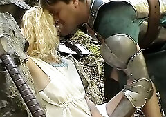 Blond sweetheart drilled by medieval knight in the forest.