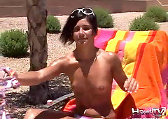Hot teen sunbathing outdoors in the hot sun