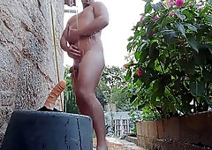 Massaging myself in the outdoor douche