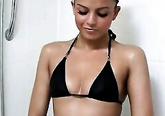 Sunburnt beauty Sasha yakes off her Ebony Bikini and fondles her juicy snatch previous to taking shower