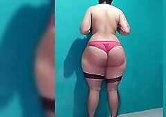 White shemale revealing her huge butt while wearing lingerie.