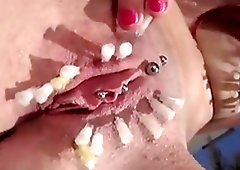 BDSM loving slut loves to torture her pussy with needles
