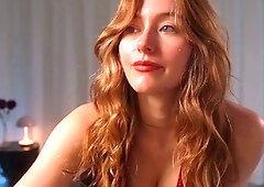 Amateur redhead Jacqueline with glasses masturbates