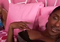 Ebony t-girl with pierced nipples vigorously strokes for the camera