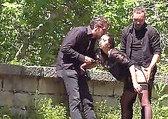 Disgraced shameless slut deepthroats in public 3some outdoor