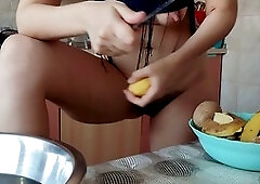 Sensual hairy brunette MILF Hermina shows off her big tits and luscious curves in the kitchen