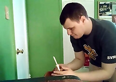 Man prepares an enema in diaper briefs with buttocks exposed in a green room