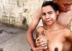 Youthful angel taking a shower with a pantyhose in the backyard and dancing to funk music.
