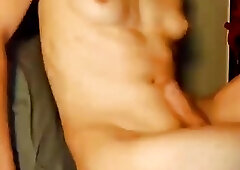 Cute shemale with small tits vigorously strokes her hard cock