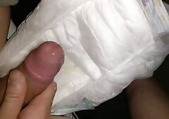 Twink cumming his wet diaper