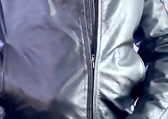 Bearded hunk in a leather jacket pleasures himself with his leather glove