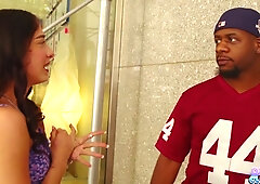 Tattooed brunette rides and gets taken hard by a muscular black man in a red jersey