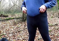 Showing cock and ass in forest