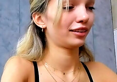 Blonde teen in solo action with her pussy