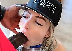 Blonde beauty working her lusty lips on big black cock