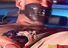 Submissive police officer tied up on the hood of a car