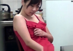 Tiny asian rubs her pussy