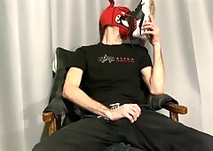 Young guy gets off while sniffing shoes and handling a thick salami