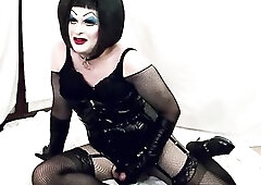 Sissy in PVC and Enormous Makeup Supplicates Corporalist to Cum