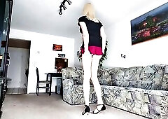 Trnsgender wears mini-petticoat, nylons and high heels