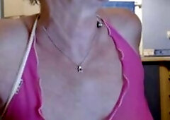 This steamy webcam video features a gorgeous granny who knows how to put on a show. With her confident smile and playful attitude, she teases and tant