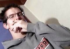 Cute twink with glasses smokes and tugs on his boner